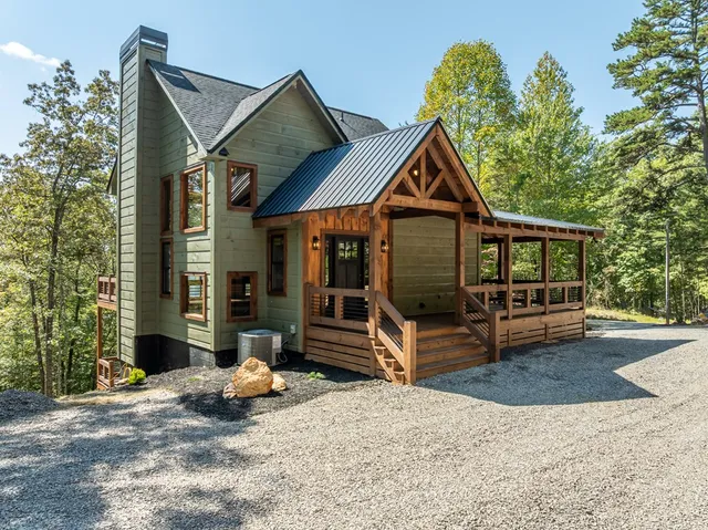 a view of a house with a door and a porch