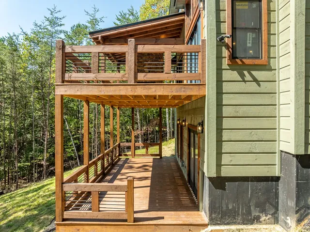 a view of a yard with large trees