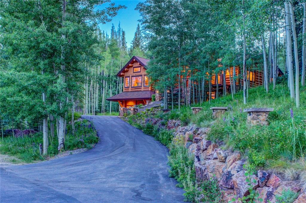279 Two Cabins Drive Silverthorne, CO 80498 - Photo 2 of 30 a sign board with a house in the background