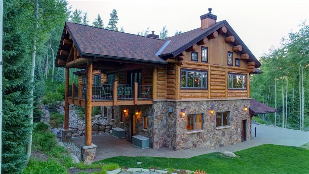 279 Two Cabins Drive Silverthorne, CO 80498 - Photo 3 of 30 a front view of a house with garden