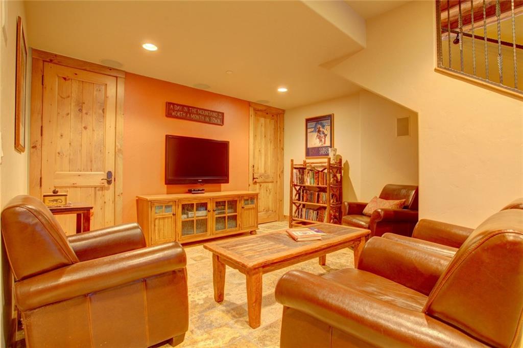 279 Two Cabins Drive Silverthorne, CO 80498 - Photo 28 of 30 a living room with furniture and a flat screen tv