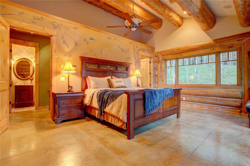 279 Two Cabins Drive Silverthorne, CO 80498 - Photo 8 of 30 a bedroom with a bed and wooden floor