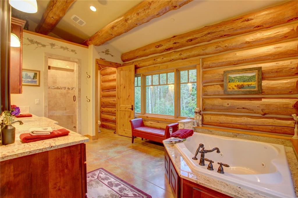 279 Two Cabins Drive Silverthorne, CO 80498 - Photo 10 of 30 a bedroom with a bed and a window