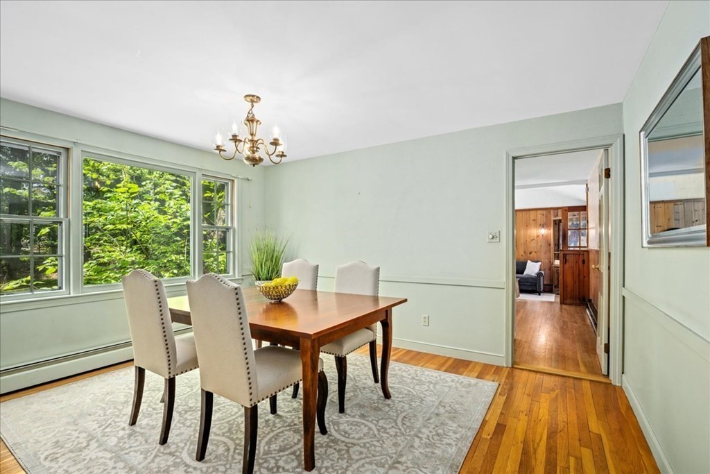 30 Cross Street Shrewsbury, MA 01545 - Photo 11 of 41 a dining room with furniture a rug and a chandelier