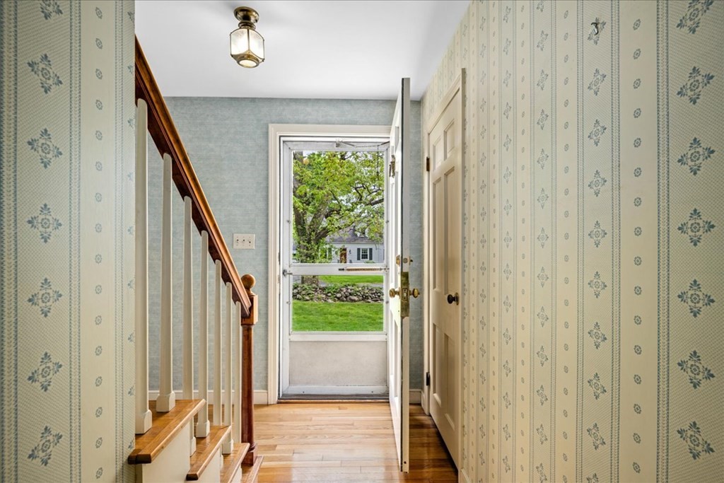 30 Cross Street Shrewsbury, MA 01545 - Photo 16 of 41 a view of a hallway with wooden floor and staircase