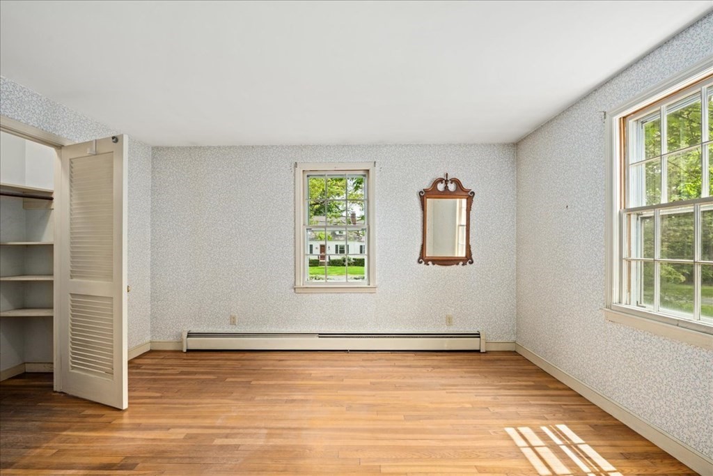 30 Cross Street Shrewsbury, MA 01545 - Photo 17 of 41 an empty room with wooden floor and windows