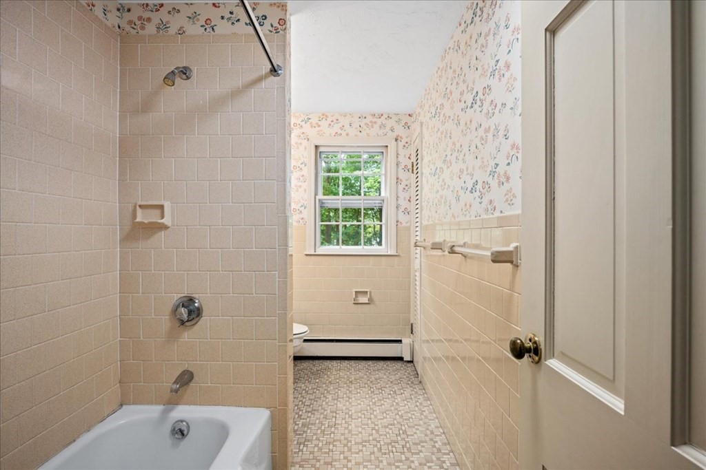 30 Cross Street Shrewsbury, MA 01545 - Photo 22 of 41 a bathroom with a shower a sink and a toilet
