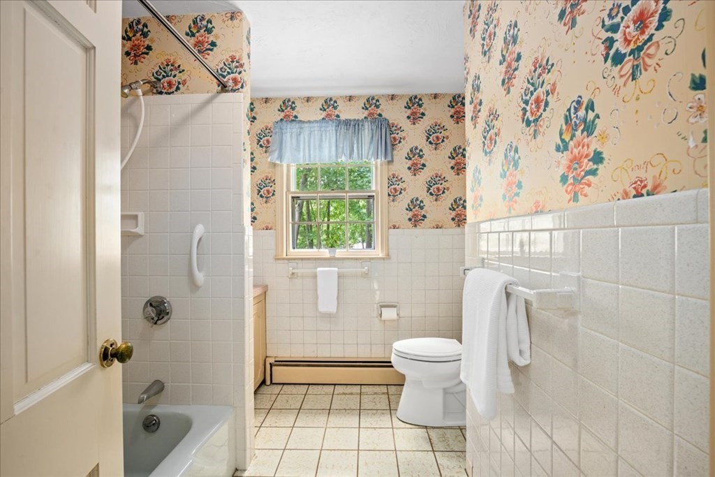 30 Cross Street Shrewsbury, MA 01545 - Photo 24 of 41 a bathroom with a toilet and a shower curtain