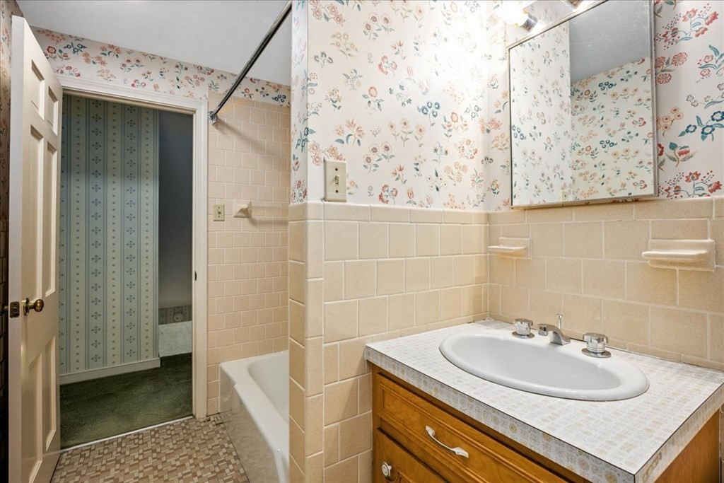 30 Cross Street Shrewsbury, MA 01545 - Photo 25 of 41 a bathroom with a sink and a mirror