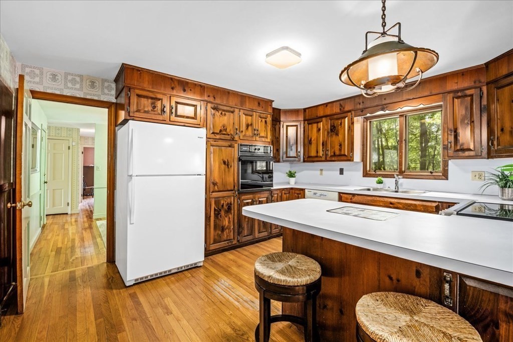30 Cross Street Shrewsbury, MA 01545 - Photo 6 of 41 a kitchen with a refrigerator and a stove