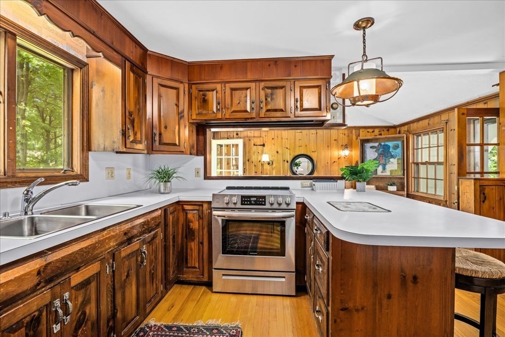 30 Cross Street Shrewsbury, MA 01545 - Photo 7 of 41 a kitchen with stainless steel appliances granite countertop a sink and a stove