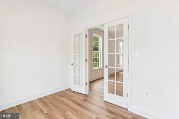 an empty room with wooden floor