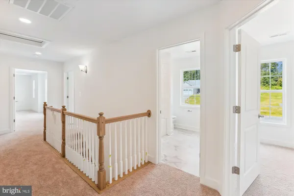 a view of empty room with wooden walls