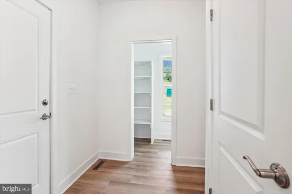 a front view of a house with swimming pool having outdoor seating