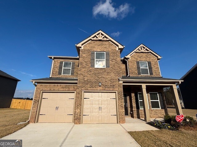 a view of a brick house with large windows