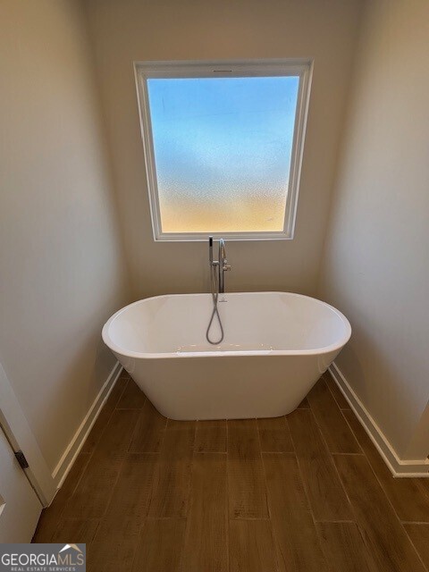 346 Jarrett Street, Unit 56 Fairburn, GA 30213 - Photo 15 of 25 a bathroom with a sink and a mirror