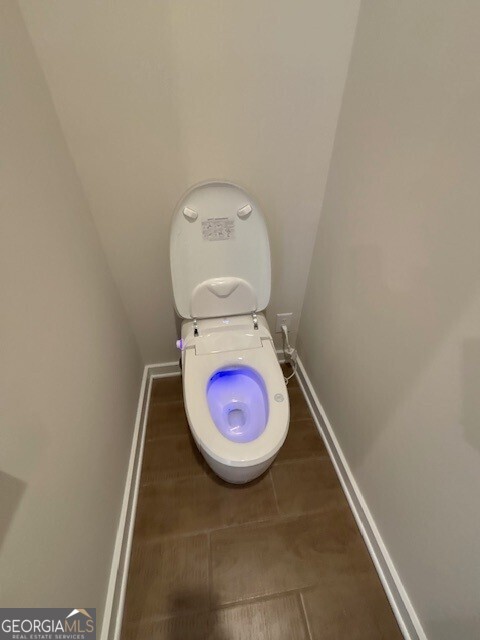 346 Jarrett Street, Unit 56 Fairburn, GA 30213 - Photo 18 of 25 a bathroom with a toilet