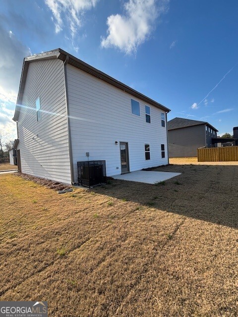 346 Jarrett Street, Unit 56 Fairburn, GA 30213 - Photo 25 of 25 a backyard of a house