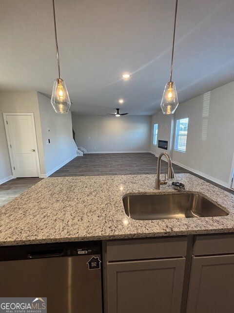 346 Jarrett Street, Unit 56 Fairburn, GA 30213 - Photo 6 of 25 a kitchen with a sink a counter space and a cabinet