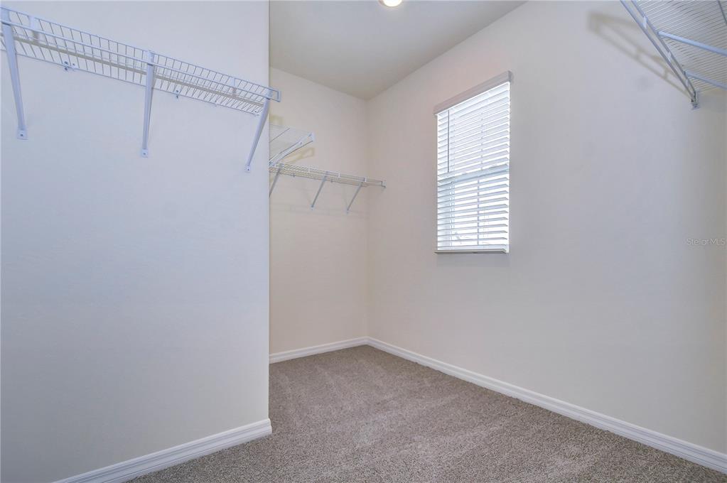 9176 Forge Breeze Loop Wesley Chapel, FL 33545 - Photo 14 of 33 a view of an empty room with a window