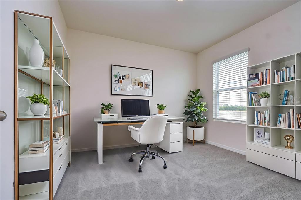9176 Forge Breeze Loop Wesley Chapel, FL 33545 - Photo 17 of 33 a workspace with furniture and window