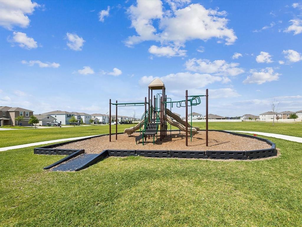 9176 Forge Breeze Loop Wesley Chapel, FL 33545 - Photo 29 of 33 a view of a park with slide