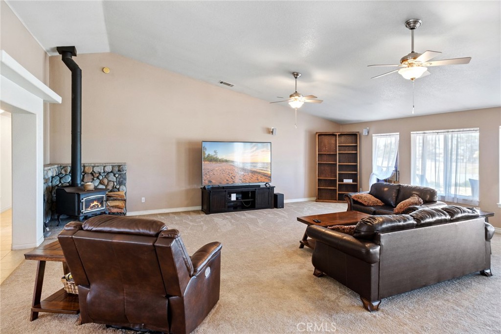 11025 El Esteban Road Phelan, CA 92371 - Photo 9 of 54 a living room with furniture and a flat screen tv