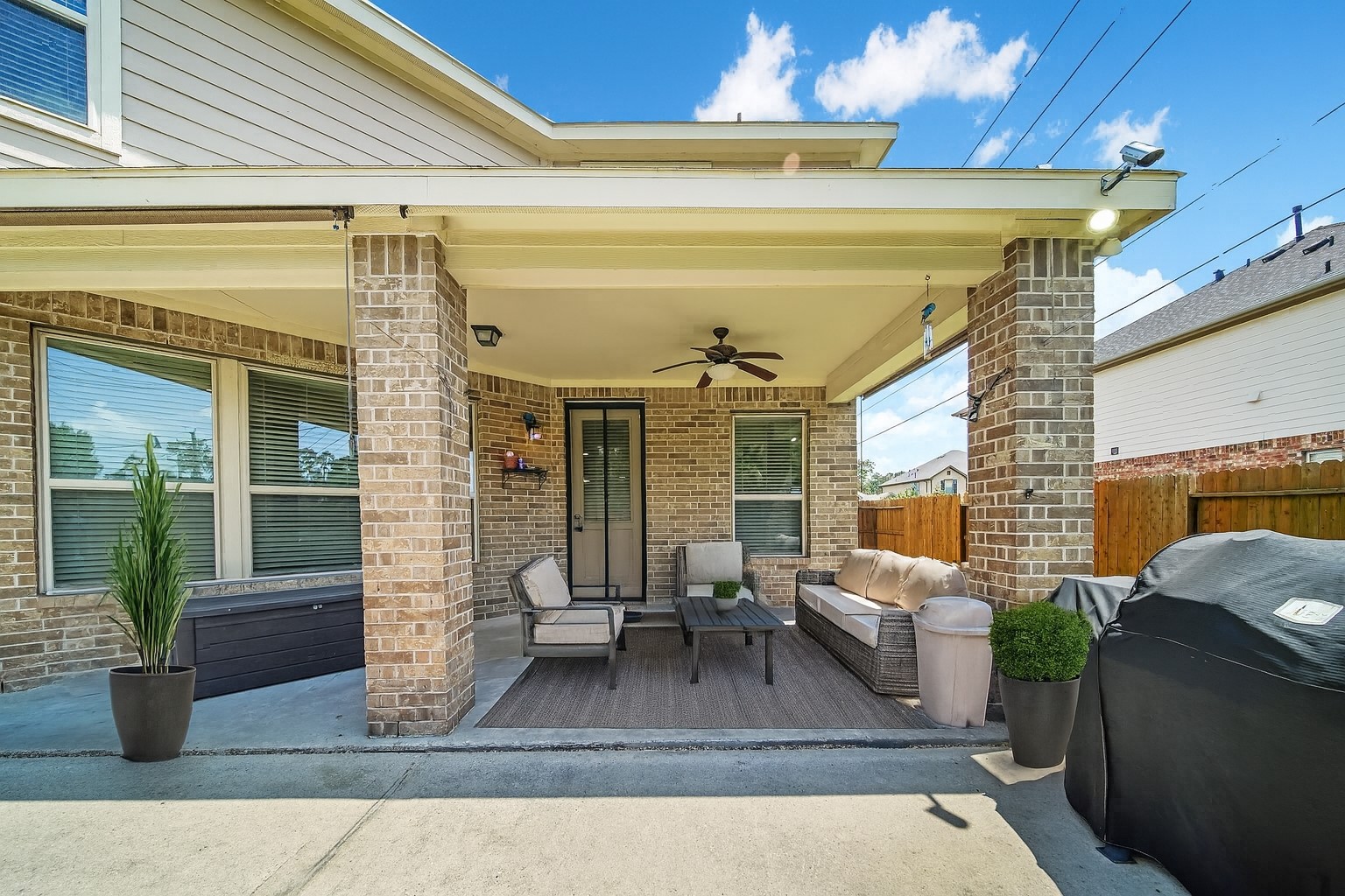 20703 Fawn Timber Trail Humble, TX 77346 - Photo 26 of 35 a view of a patio with couches chairs and potted plants