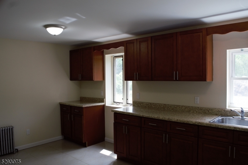 55 Highway 23, Unit 1 Hamburg, NJ 07419 - Photo 3 of 14 a kitchen with a sink and a window