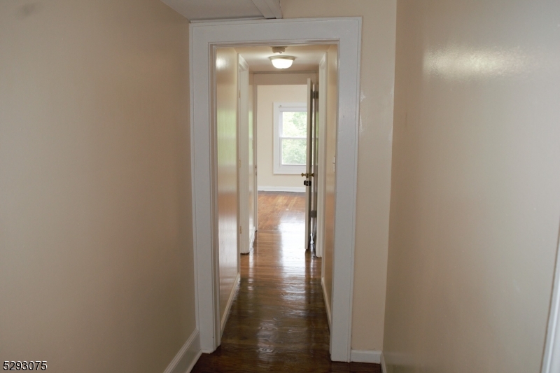 55 Highway 23, Unit 1 Hamburg, NJ 07419 - Photo 7 of 14 a view of a hallway with wooden floor and a door