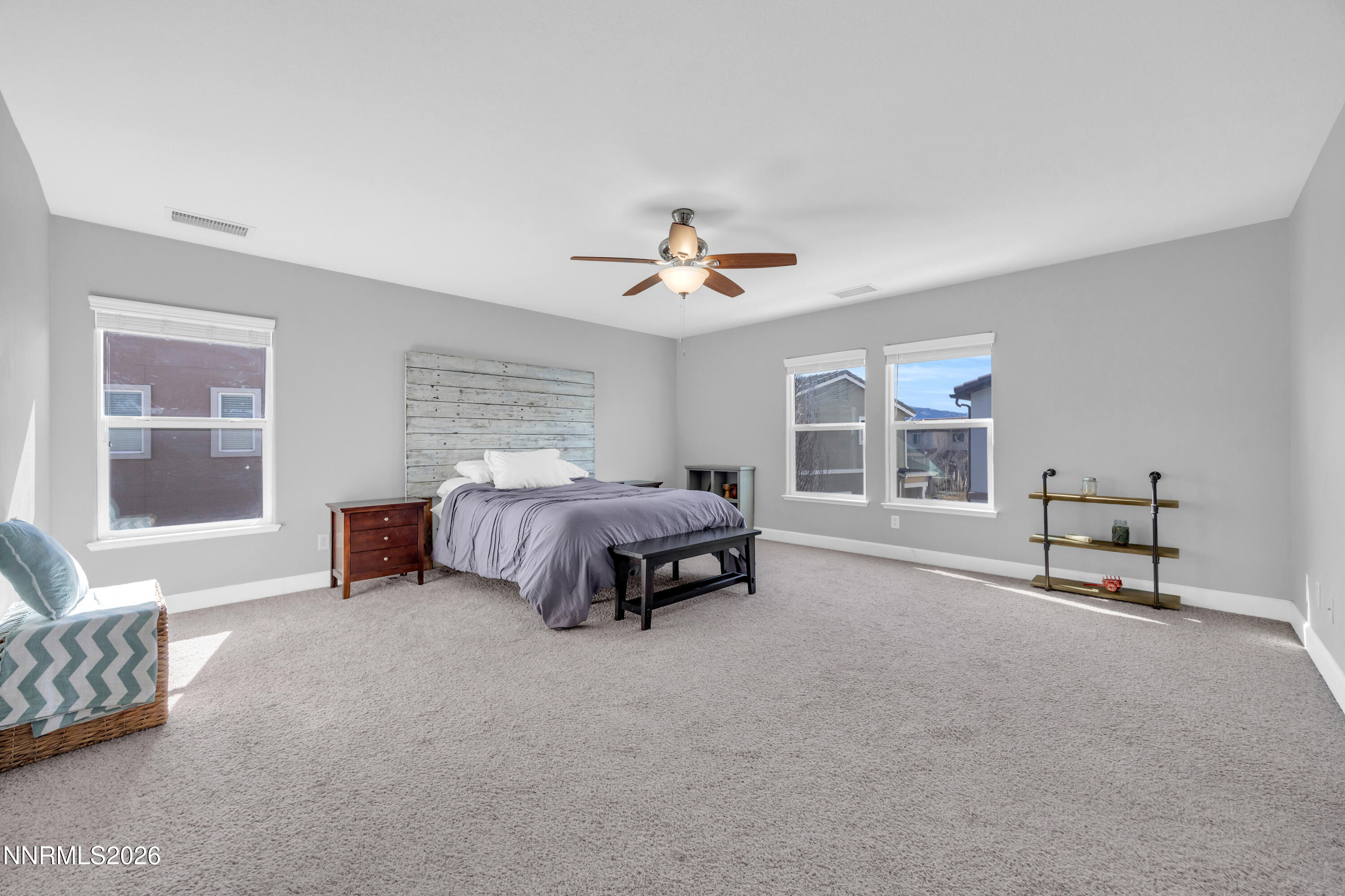 2085 Black Sand Drive Reno, NV 89521 - Photo 14 of 37 a spacious bedroom with a bed and a window