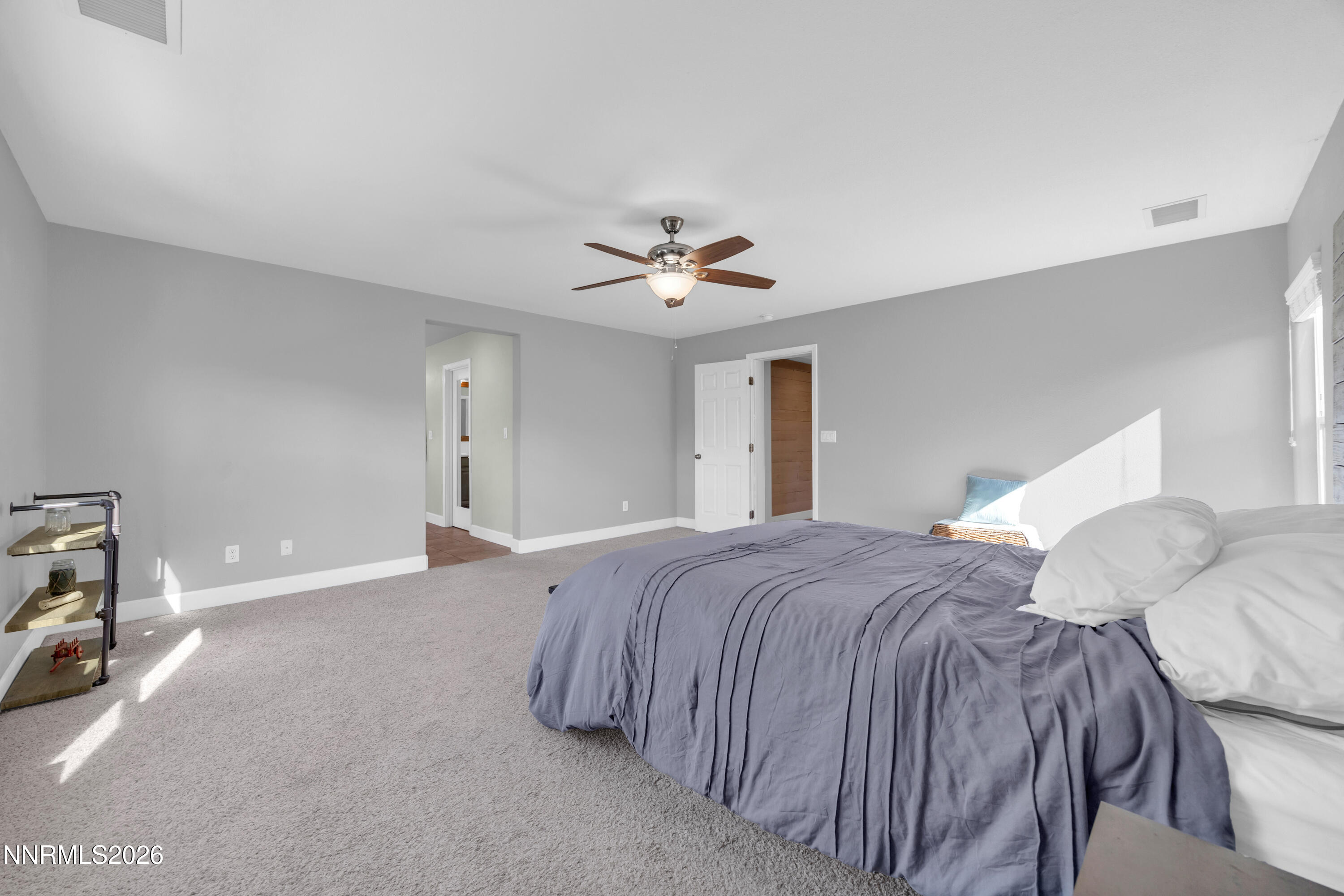 2085 Black Sand Drive Reno, NV 89521 - Photo 15 of 37 a bedroom with a bed and a ceiling fan