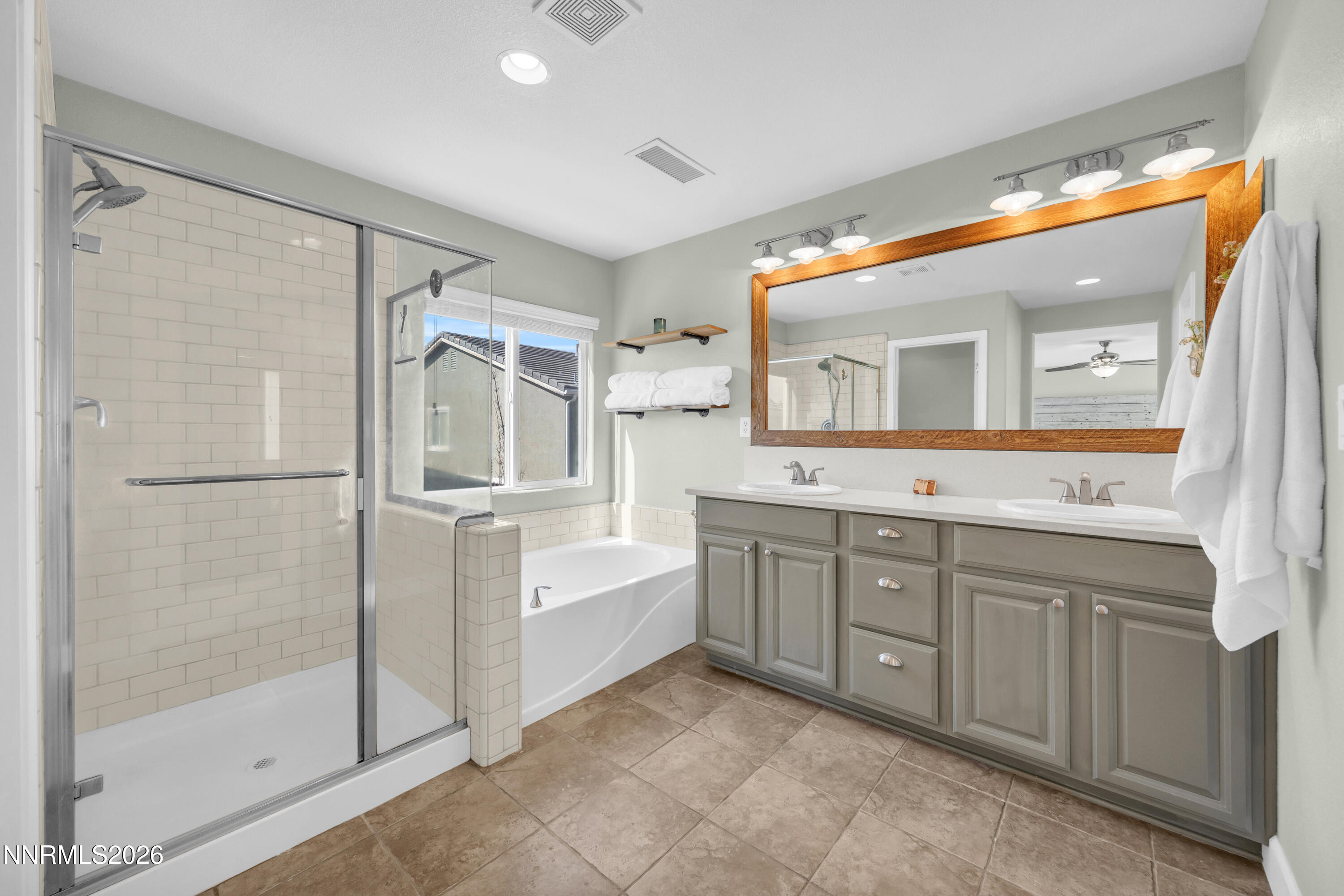 2085 Black Sand Drive Reno, NV 89521 - Photo 16 of 37 a spacious bathroom with a shower sink and mirror