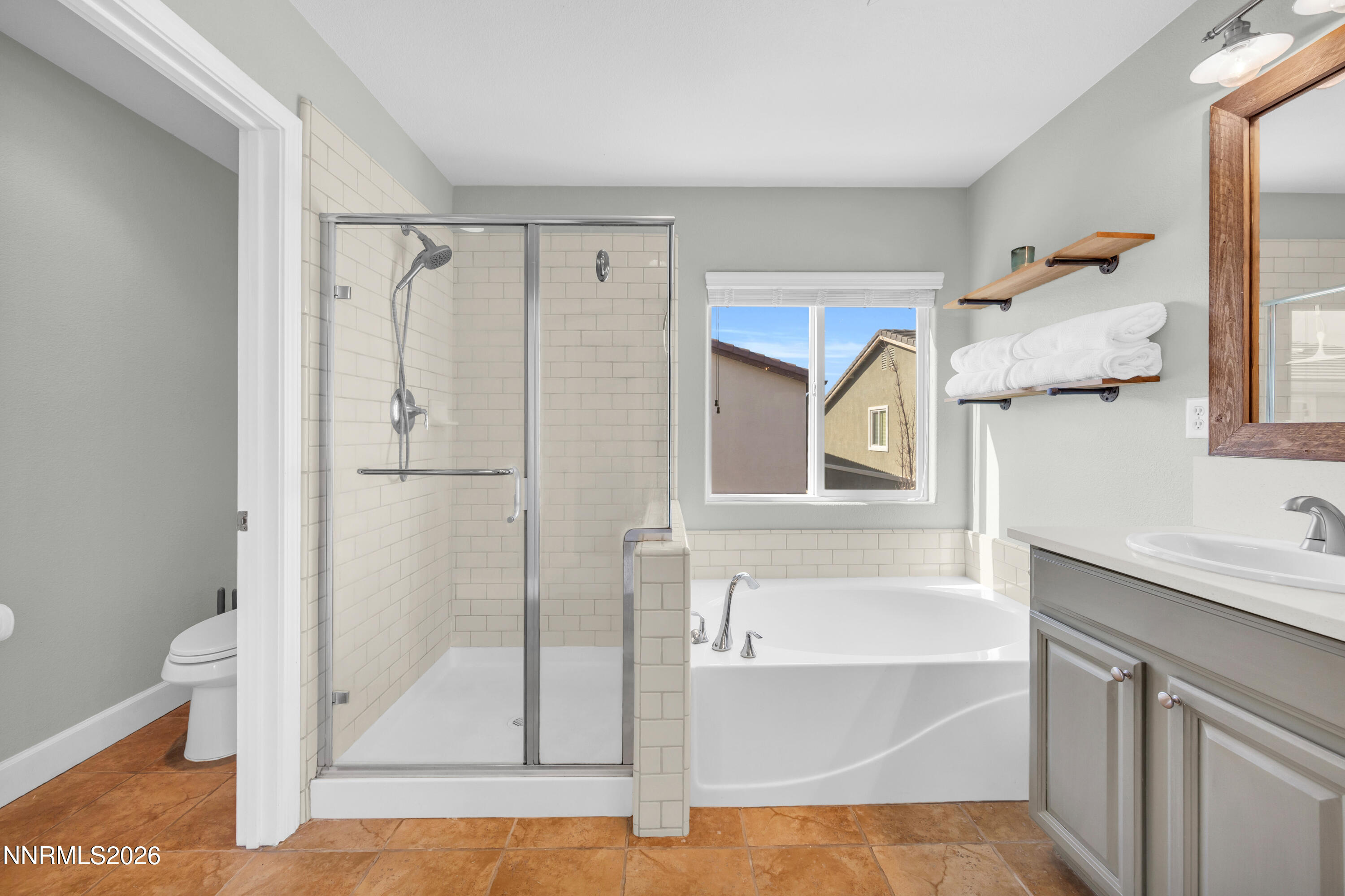 2085 Black Sand Drive Reno, NV 89521 - Photo 17 of 37 a bathroom with a tub and a shower