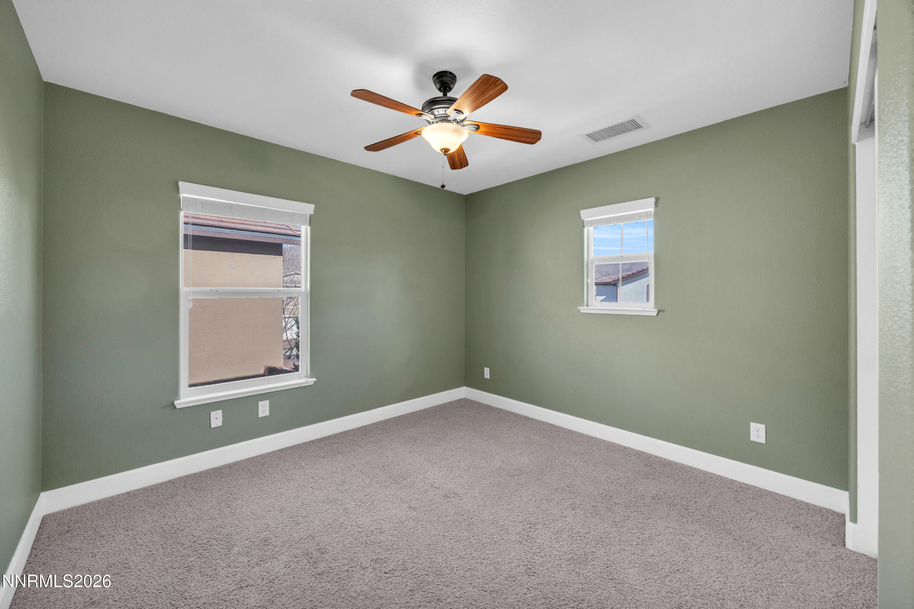 2085 Black Sand Drive Reno, NV 89521 - Photo 19 of 37 an empty room with window and ceiling fan