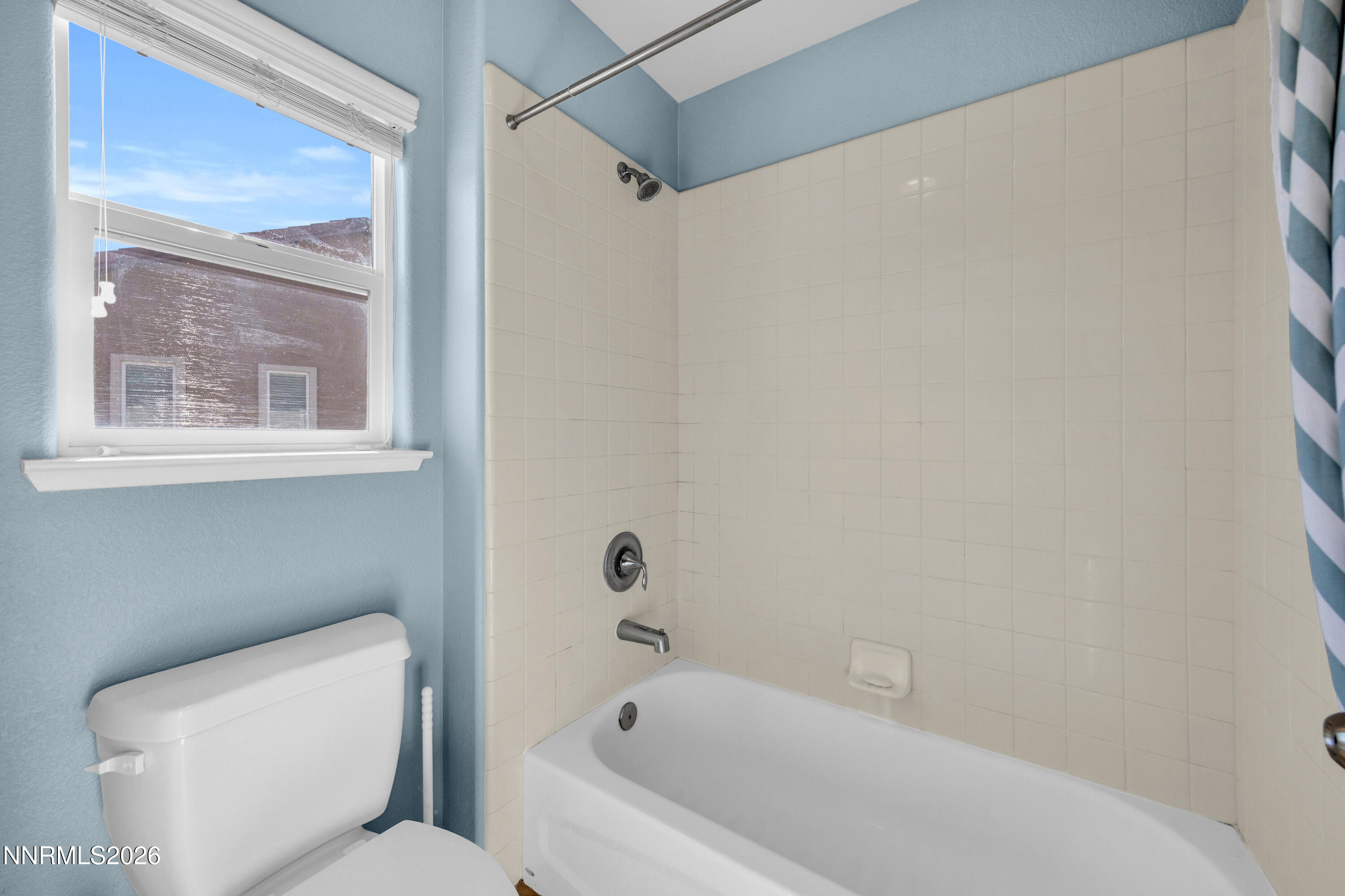 2085 Black Sand Drive Reno, NV 89521 - Photo 23 of 37 a bathroom with a toilet and a bathtub