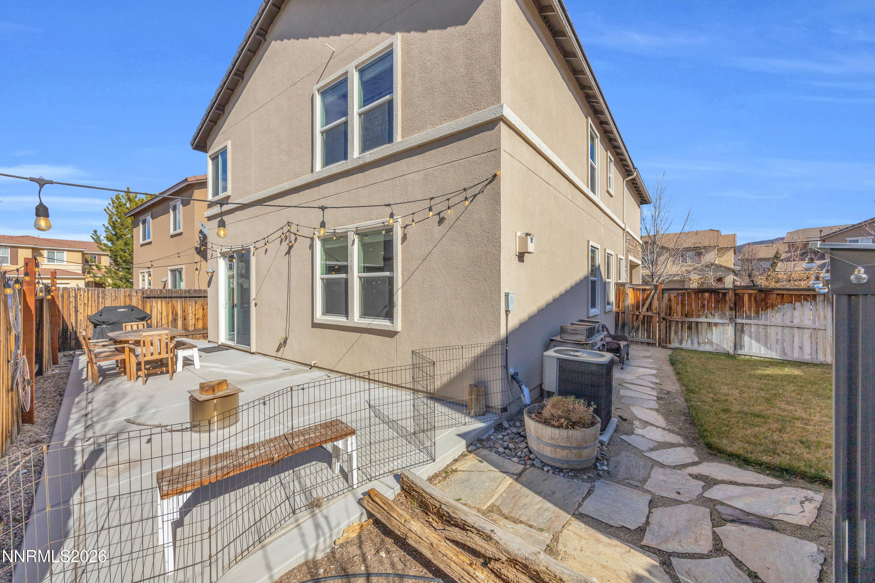 2085 Black Sand Drive Reno, NV 89521 - Photo 24 of 37 a view of a patio with couches table and chairs and potted plants