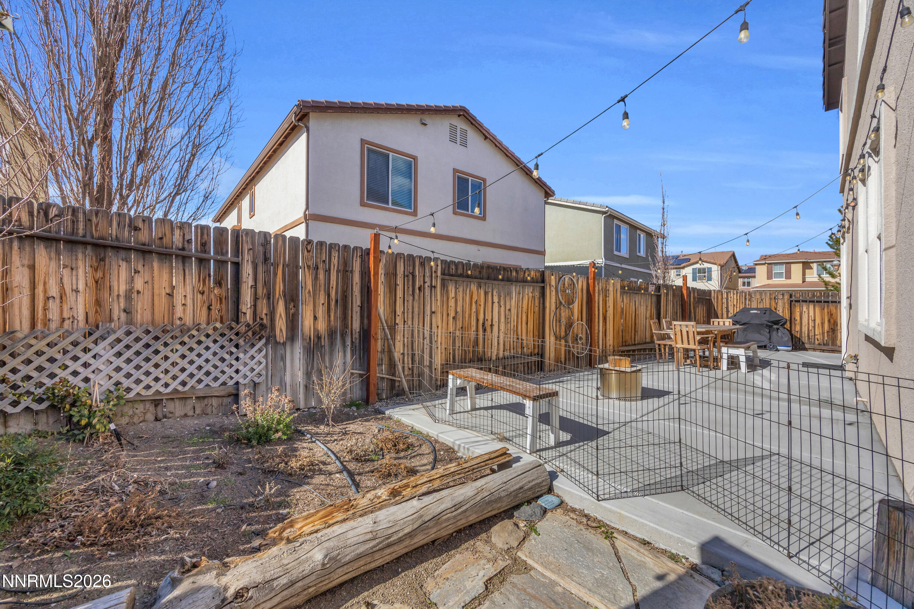 2085 Black Sand Drive Reno, NV 89521 - Photo 25 of 37 a backyard of a house with yard and outdoor seating