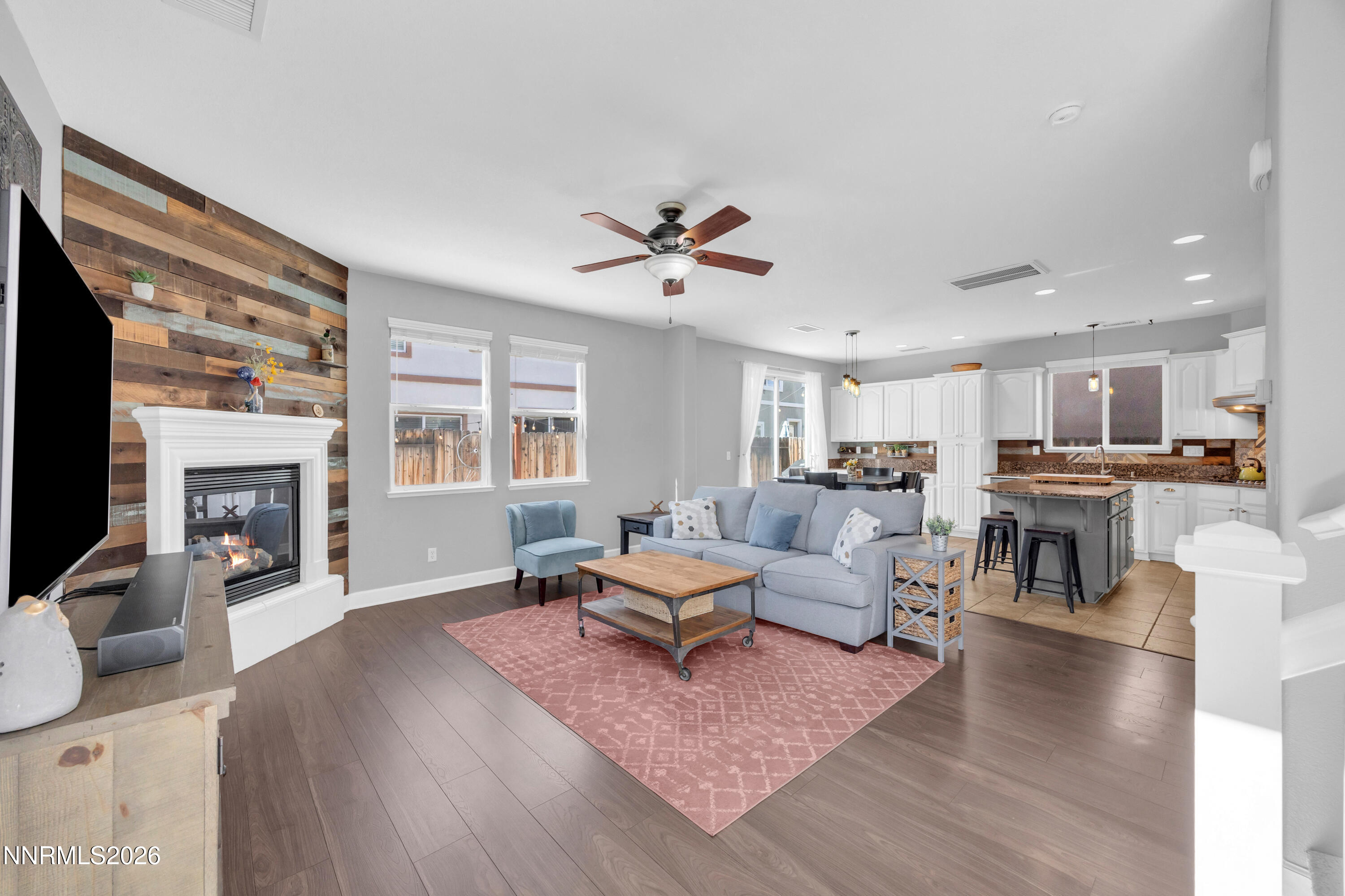 2085 Black Sand Drive Reno, NV 89521 - Photo 3 of 37 a living room with furniture kitchen view and a fireplace