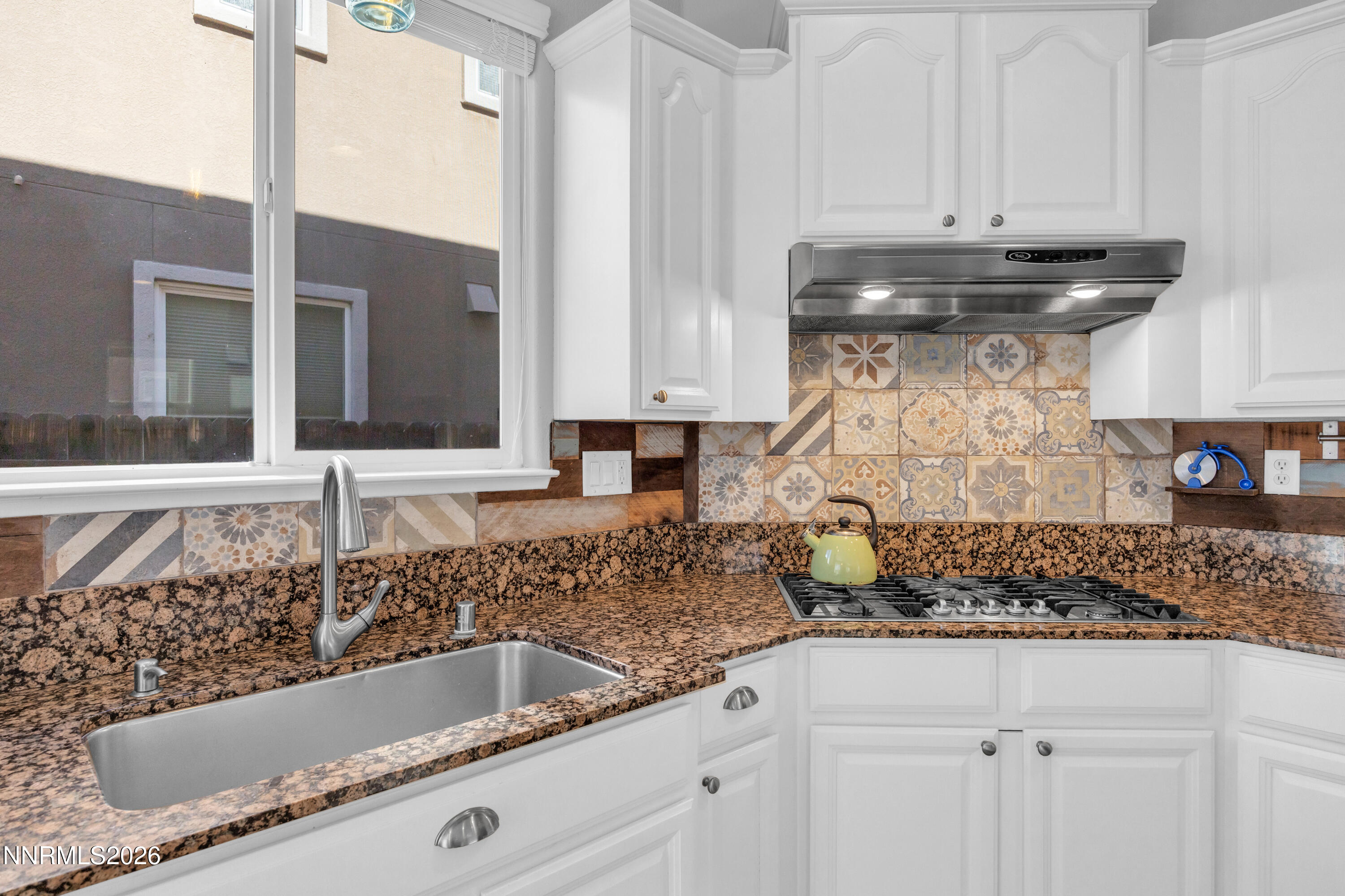 2085 Black Sand Drive Reno, NV 89521 - Photo 8 of 37 a kitchen with a sink and cabinets