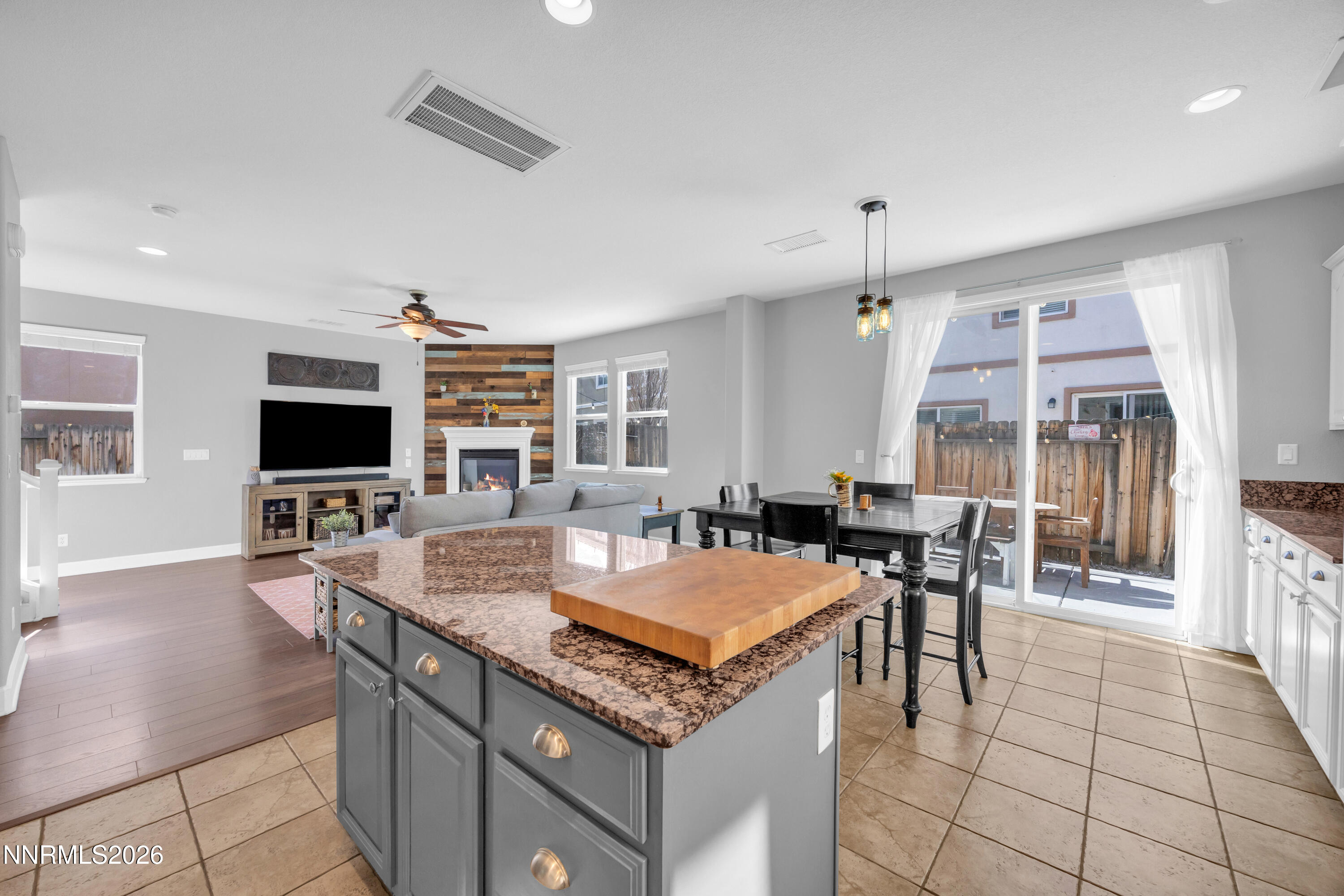 2085 Black Sand Drive Reno, NV 89521 - Photo 9 of 37 a living room with furniture a flat screen tv and a table