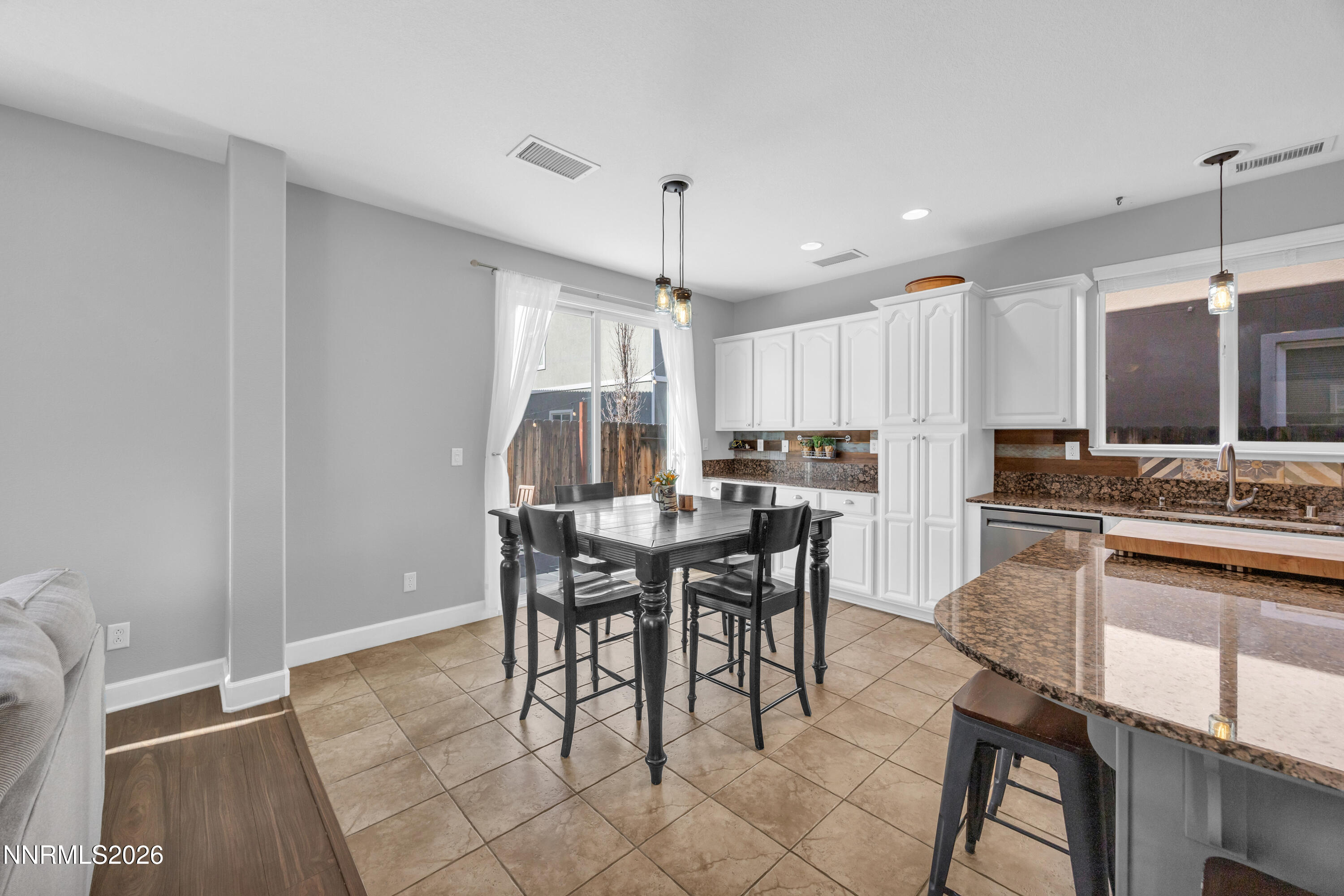 2085 Black Sand Drive Reno, NV 89521 - Photo 10 of 37 a view of a dining room with furniture and a chandelier