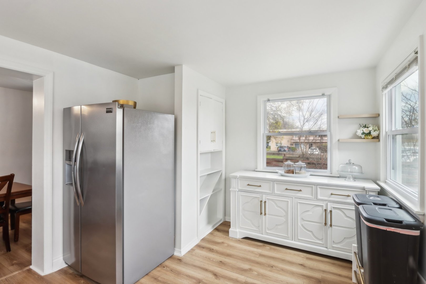 197 6th Street Wheeling, IL 60090 - Photo 27 of 51 a kitchen with white cabinets and white appliances