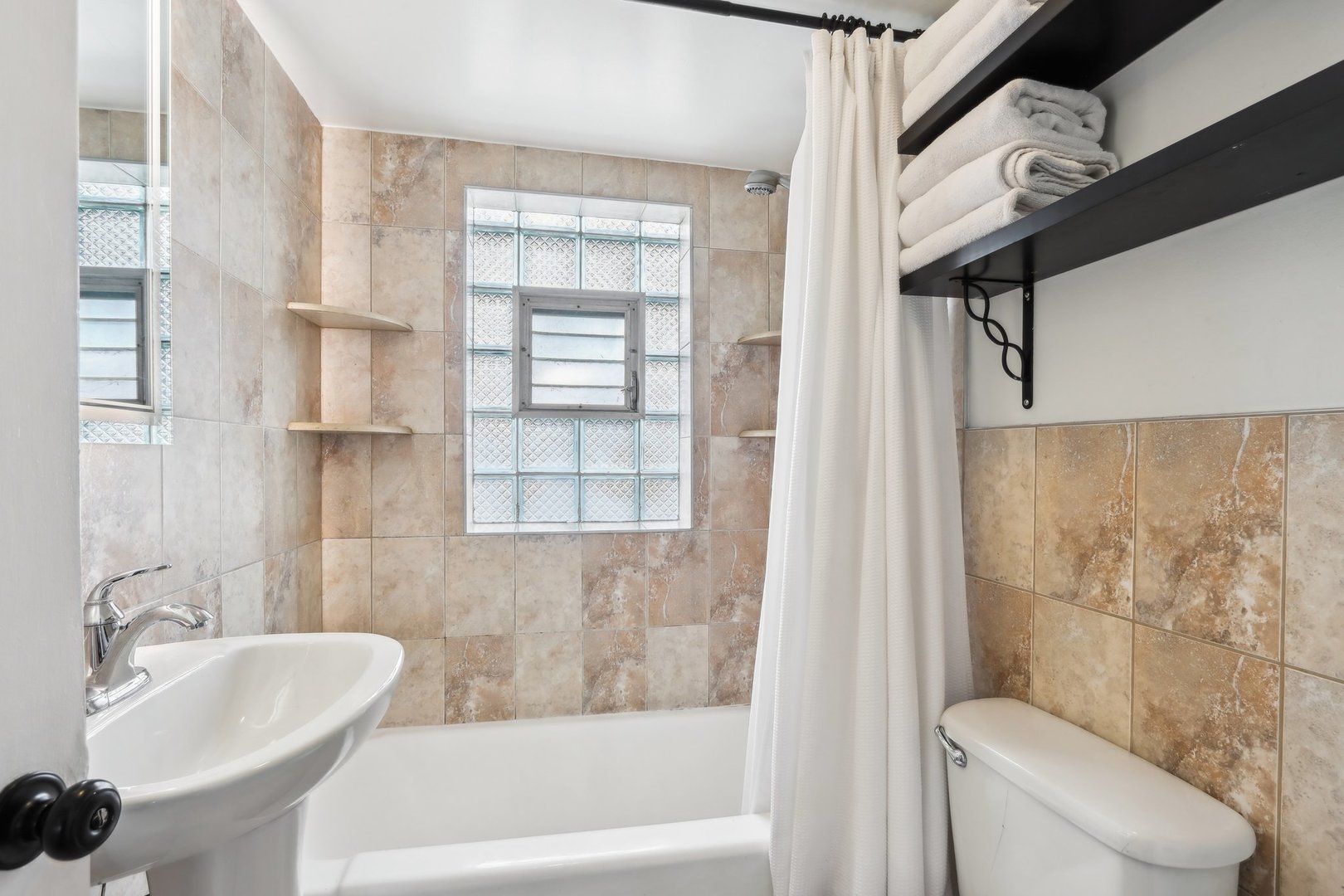 197 6th Street Wheeling, IL 60090 - Photo 29 of 51 a bathroom with a sink a toilet and shower