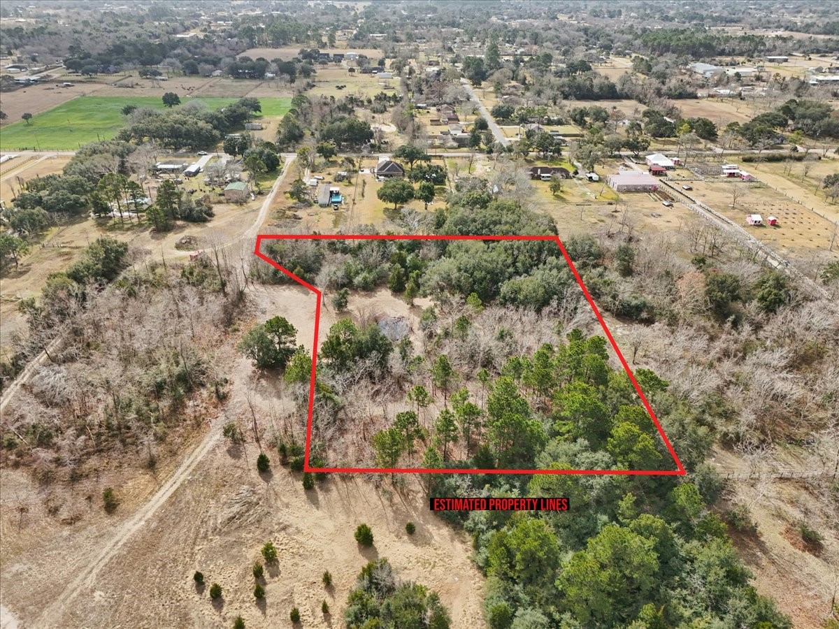0 Blessing Way Santa Fe, TX 77510 - Photo 2 of 12 an aerial view of a house with a yard and large trees