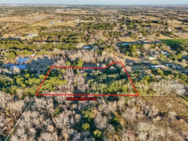 an aerial view of residential building and ocean