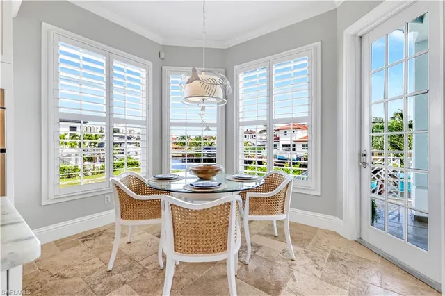 a kitchen with stainless steel appliances kitchen island granite top and refrigerator