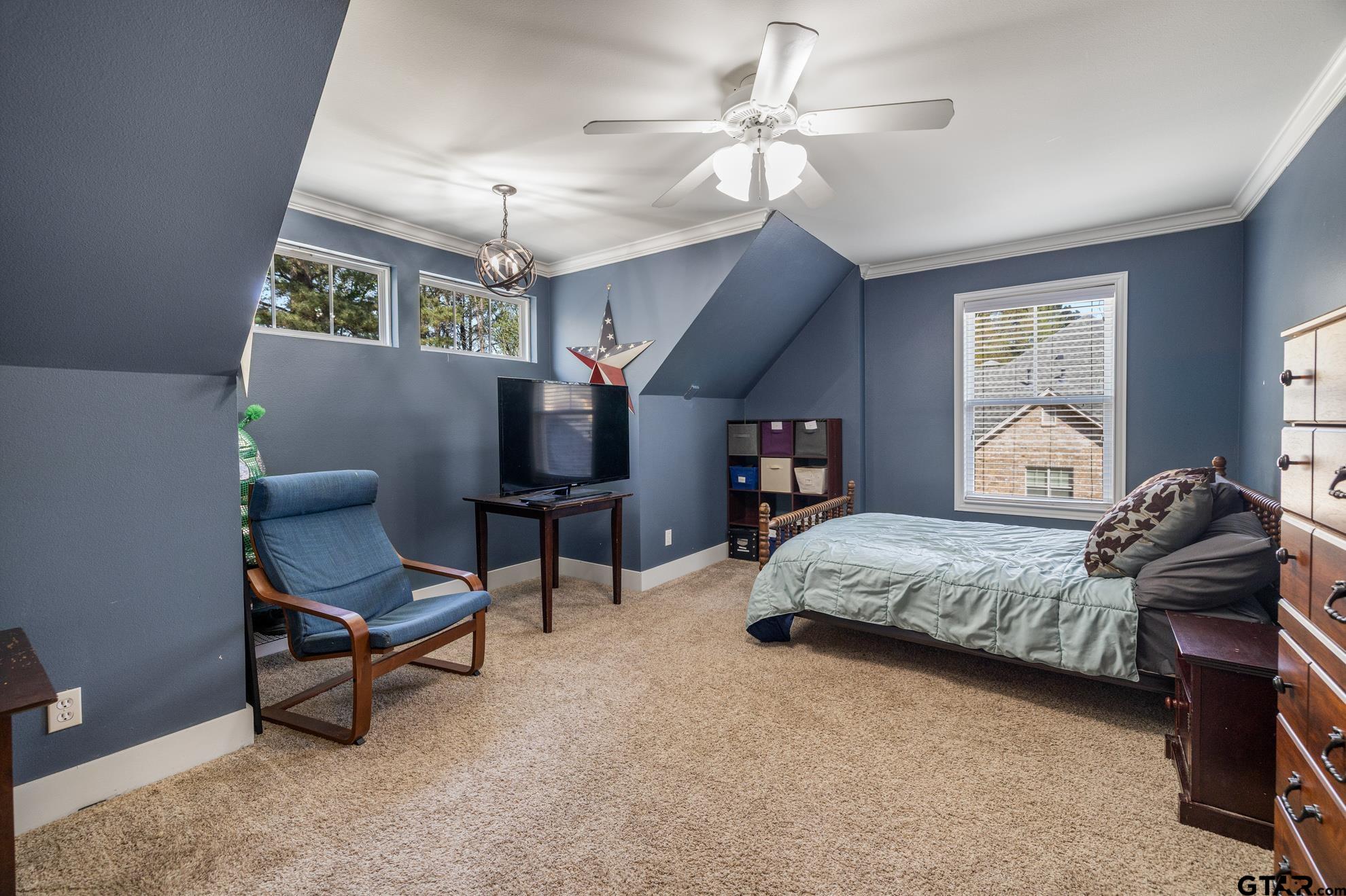 9453 Cherokee Trail Tyler, TX 75703 - Photo 33 of 40 a bedroom with a bed chair and window