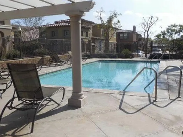 a patio with table and chairs