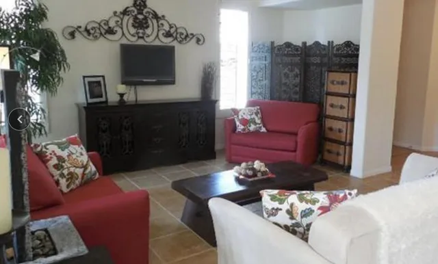 a living room with furniture and a flat screen tv